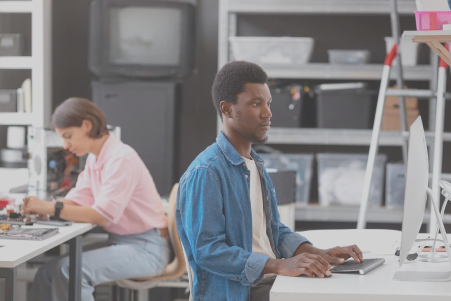 Business professional reviewing financial data on multiple screens
